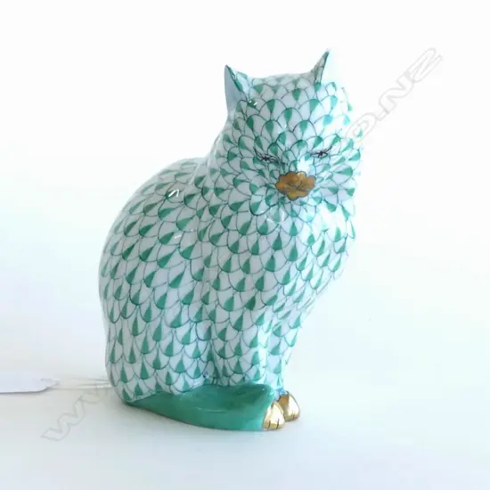 A Herend Porcelain cat, in green 'fishnet' pattern